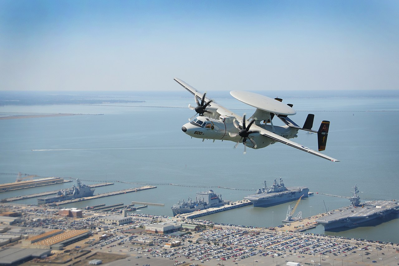 An E-2 D Hawkeye over Naval Station Norfolk