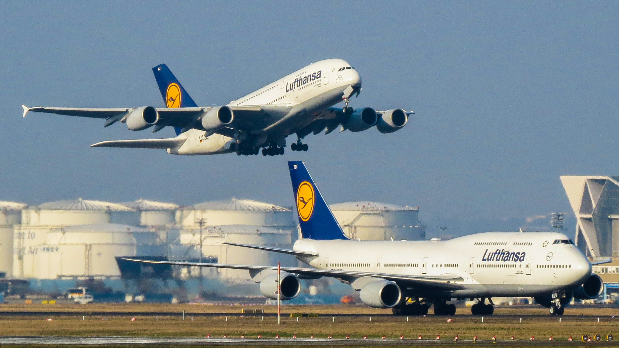 A pair of Lufthansa airliners.