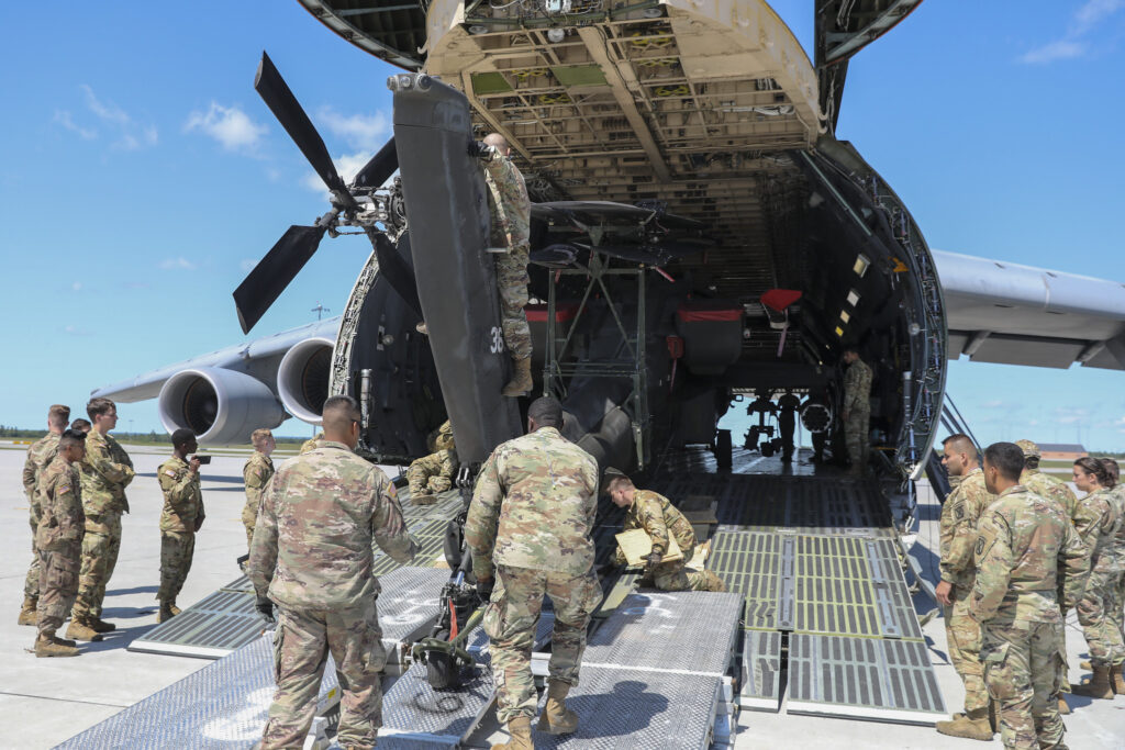 An AH-64 loaded into a C-5.