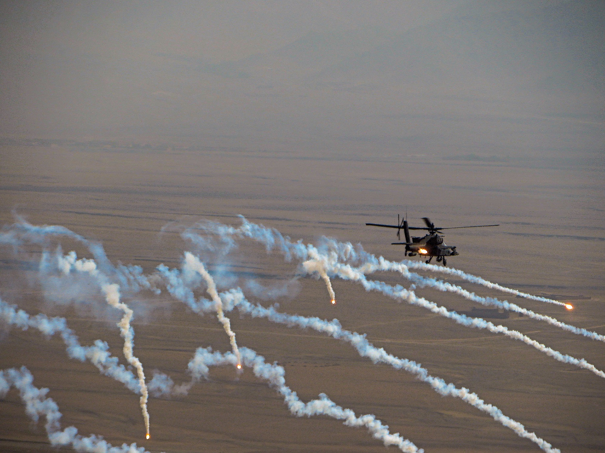 AH-64 popping flares.