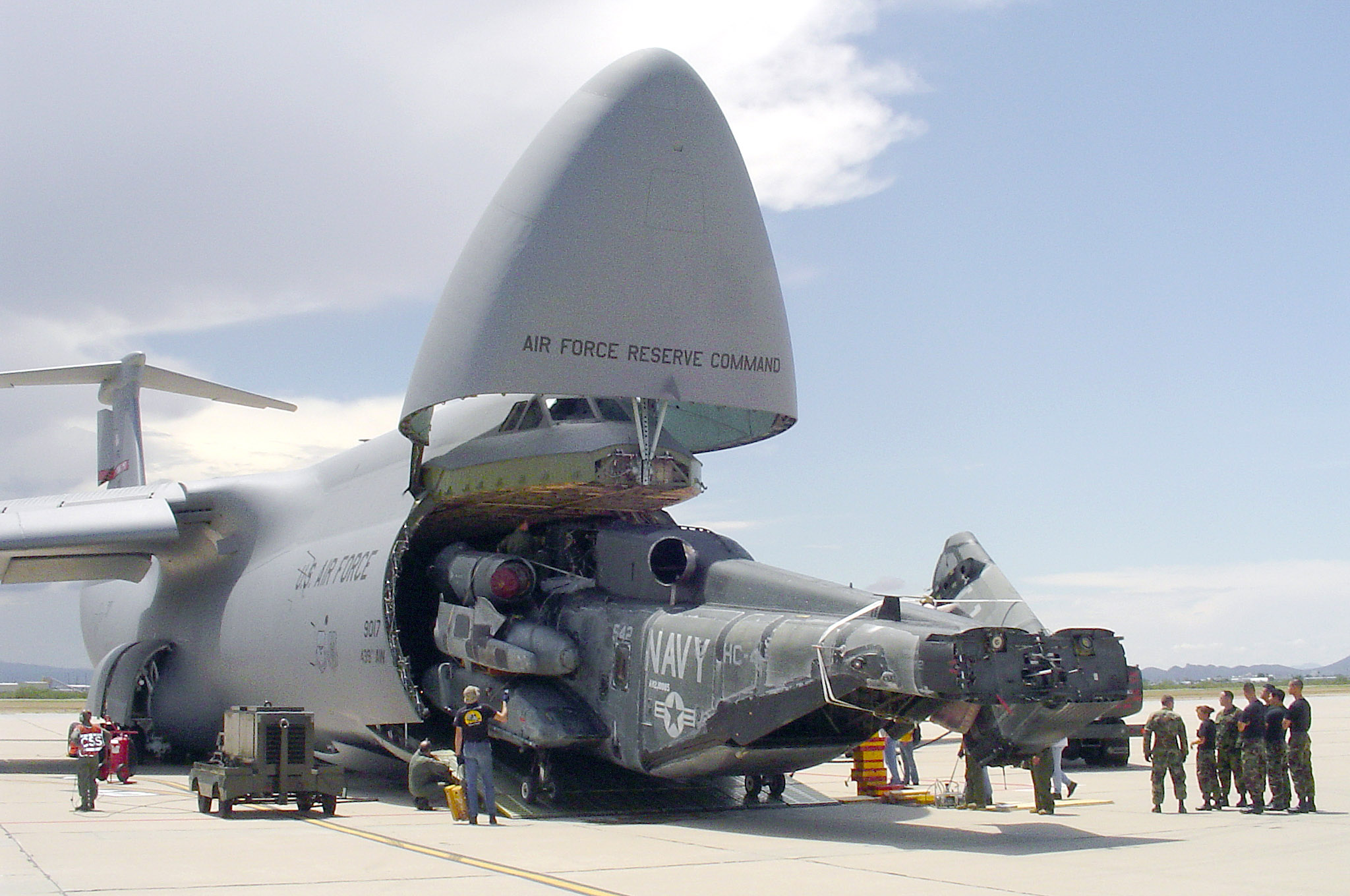 The C-5 can swallow helicopters with ease.