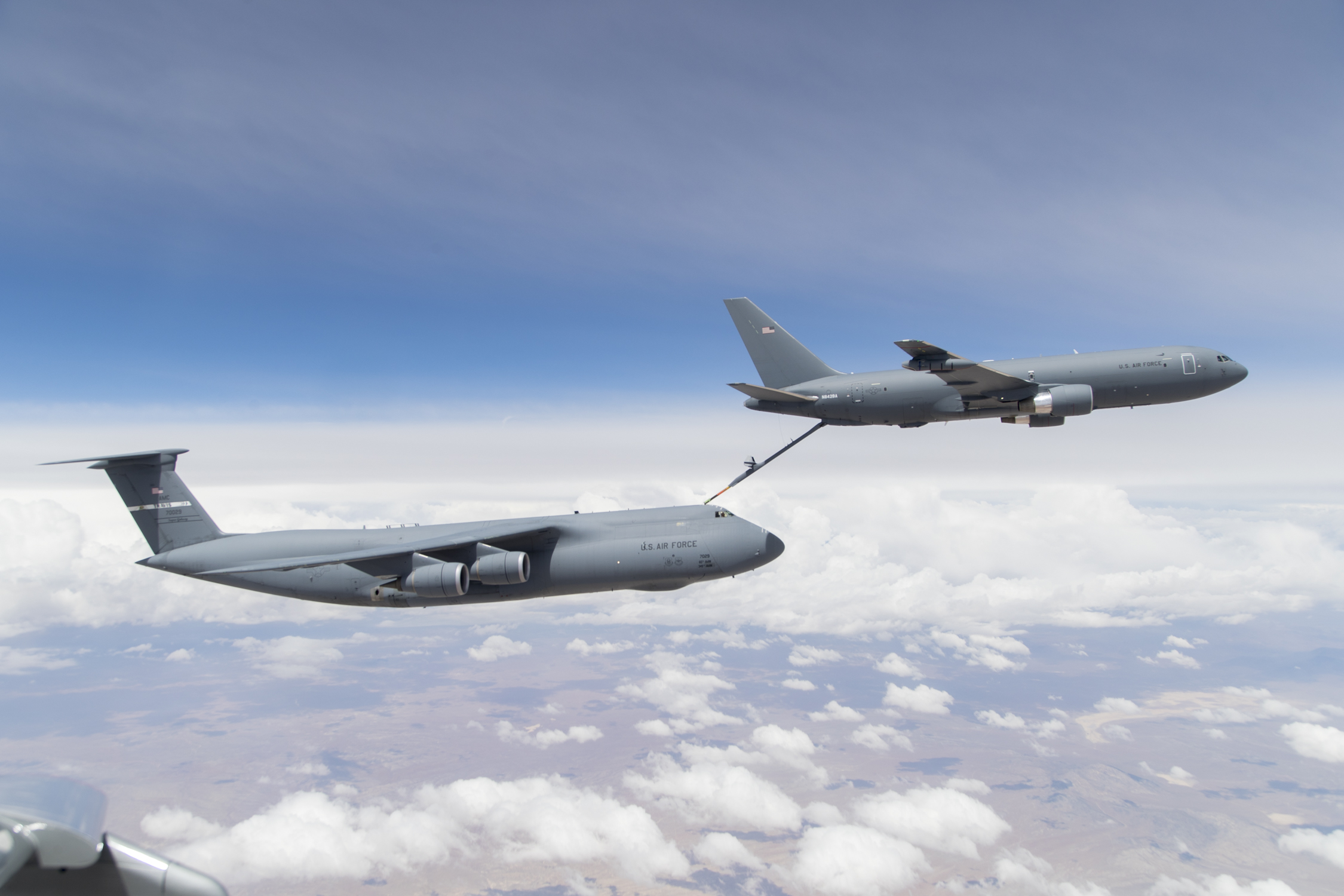 A KC-46 refuels a C-5M.