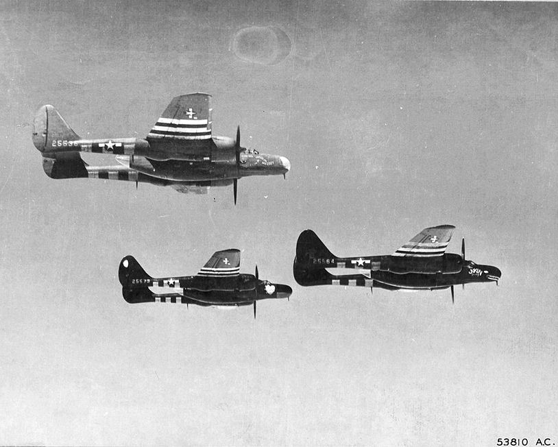 A flight of three P-61s in formation.