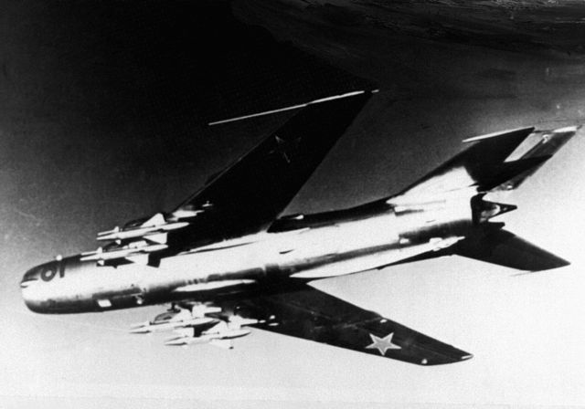 An underside shot of a MiG 19 carrying missile armament.