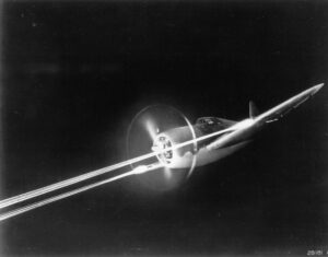 A P-47 firing its M2 50 cal machine guns at night.