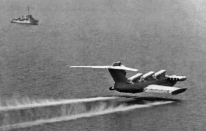Lun-class flying in the ground effect past a ship.