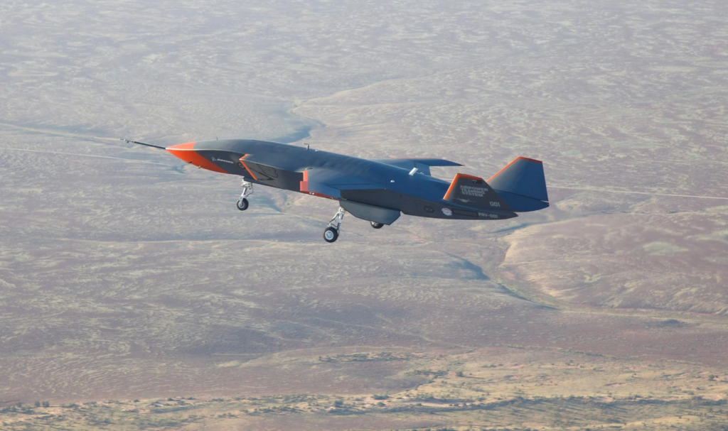 The MQ-28A in flight with gear deployed.