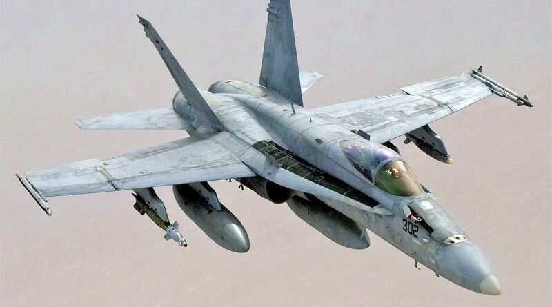 An F/A-18 C over the desert.