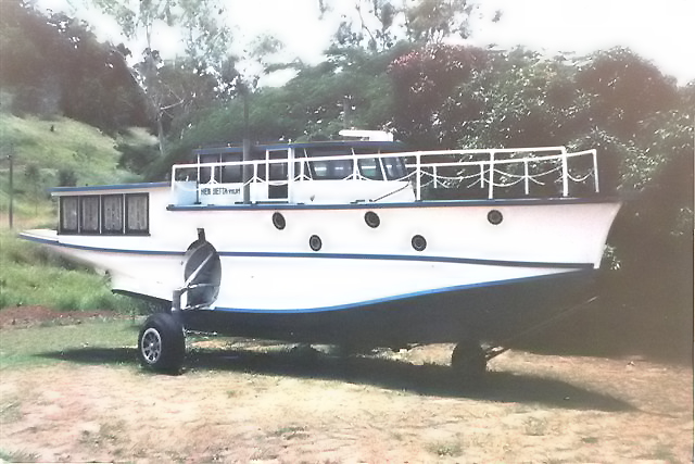The undercarriage is a giveaway that this houseboat came from a Catalina.