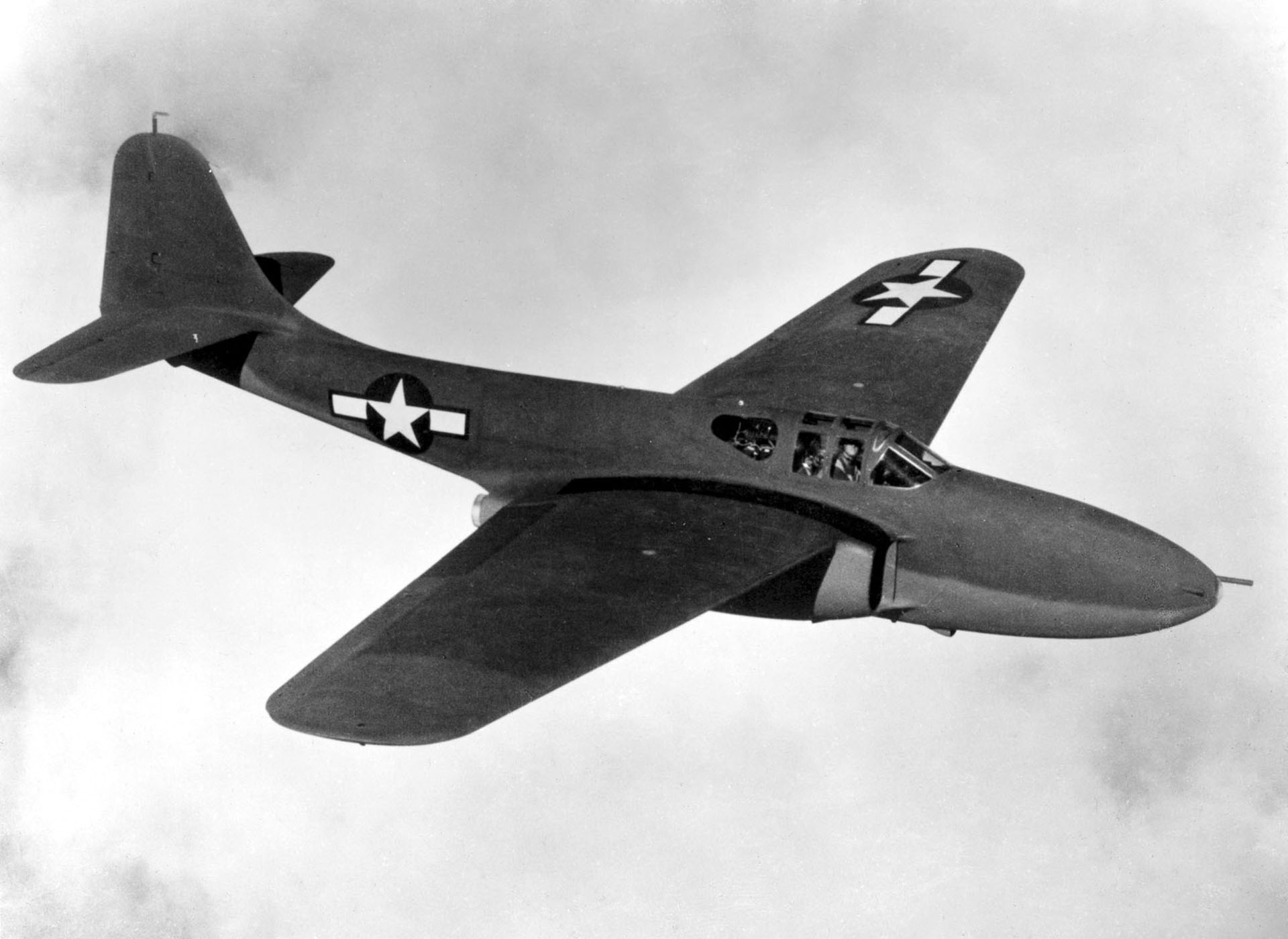 The YP-59A in flight.