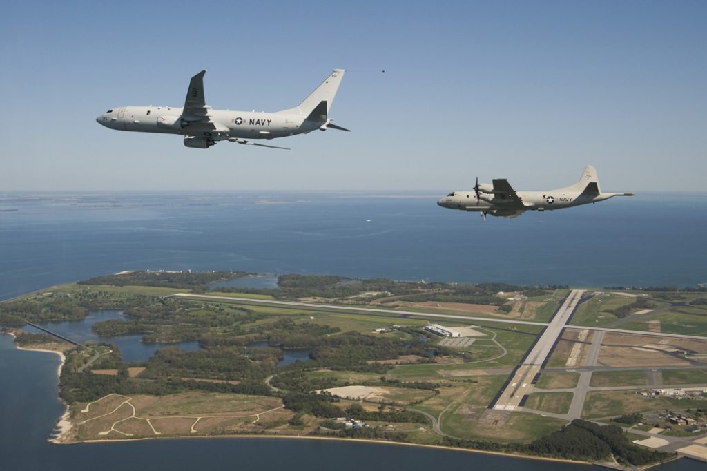 A P-8A flying with a P-3.