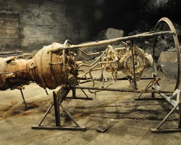 A rusty V-2 rocket engine in the original underground production facilities at the Dora-Mittelbau concentration camp memorial site.
