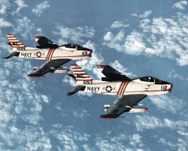 Two U.S. Navy North American FJ-3M Fury (BuNo 136153, 139225) of Fighter Squadron 53 (VF-53) "Blue Knights" in flight. VF-53 was assigned to Air Task Group 3 (ATG-3) aboard the aircraft carrier USS Kearsarge (CVA-33) for a deployment to the Western Pacific from 9 August 1957 to 2 April 1958.